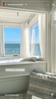 there is a window that looks out to the ocean