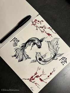 a pen and ink drawing of two birds on a piece of paper with chinese writing