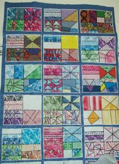 a quilt made with many different colored squares