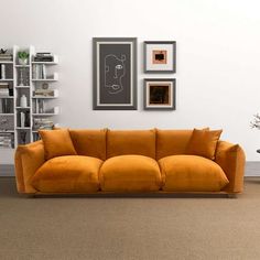 Combining the timeless charm of mid-century modern design with the luxurious comfort of a cloud couch, this sofa embodies sophistication and relaxation. Its generously oversized proportions make it ideal for both unwinding alone and hosting lively gatherings with friends and family. Crafted with a solid wood frame and legs, this sofa ensures lasting durability and stability while enhancing its overall elegance. It exudes luxury and style, elevating any living space with its plush comfort and vis Orange Velvet Sofa, Modern Couch Sectional, Cloud Couch, Burnt Orange Velvet, Large Couch, Comfortable Couch, Dining Table Rug, Plush Sofa, Orange Velvet