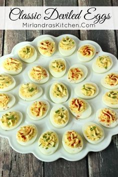 deviled eggs on a white plate with the words classic deviled eggs