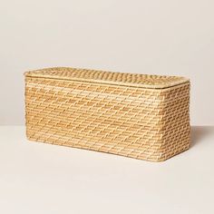 an empty wicker box on a white surface