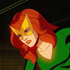 an animated image of a woman with red hair wearing a green cape and yellow mask