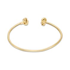 This sweet cuff bracelet is a stylish twist on a fashion classic. Crafted in warm 14K gold, this open look is accented with a pair of textured love knot end designs. Polished to a bright shine and sure to be a constant choice, this flexible 7.0-inch bracelet slips on and off for easy anytime wear. Zales Zales, Peoples Jewellers, Love Knot, 1 Carat, Bracelet Designs, Yellow Color, Fashion Bracelets, Cuff Bracelet, Types Of Metal