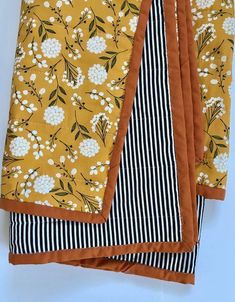 four pieces of fabric with flowers and stripes on them, all in different colors or patterns