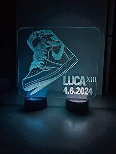 a light up sneaker shoe with the name luga xxii on it in front of a black background