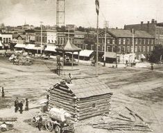 an old black and white photo of a town