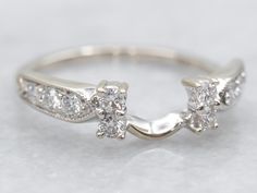 a white gold ring with three diamonds on it