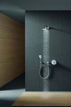 a shower head and hand held shower faucet in a bathroom