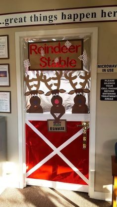 the door to reindeer stable is decorated in red and white