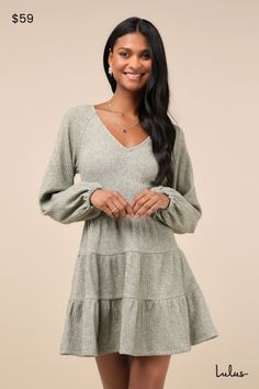 There's no better pick than the Lulus Adorable Option Heather Green Long Sleeve Mini Sweater Dress to be your new favorite fall addition! This darling sweater dress is composed of stretchy ribbed knit (with a subtle heathered effect throughout) that shapes a darted bodice, a V-neckline, and long balloon sleeves with elastic at the cuffs. The fitted, banded waist tops a tiered, skater-style skirt that finishes at a mini hem. Fit: This garment fits true to size. Length: Mid-thigh. Size medium measures 34.00" from shoulder to hem. Bust: Great for any cup size. Waist: Fitted - elastic waist allows stretch. Hip: Not Fitted - fuller skirt allows room for hips. Undergarments: May be worn with any standard bra. Fabric: Fabric is very stretchy. Unlined. 47% Polyester, 30% Viscose, 20% Nylon, 3% Spa Casual Knit Mini Dress For Fall, Knit Long Sleeve Mini Dress For Fall, Knit Mini Dress For Fall Day Out, Ribbed Dresses For Fall Day Out, Ribbed Dresses For Day Out In Fall, Ribbed Loungewear Dresses For Fall, Fall Ribbed Loungewear Dresses, Fall Day Out Ribbed Dresses, Casual Fall Dresses For Loungewear