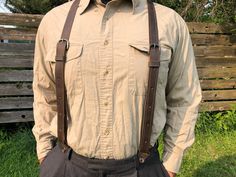 "These leather button suspenders were precisely crafted to match suspenders made in 1900's in the New and Old World. This unique set is simply a great combination for work, casual and formal events, and wonderfully fit for special occasions such as weddings. We have been crafting hundreds of these unique handmade leather suspenders for weddings all over the world! Our suspenders add a fine touch to those memories that you will treasure forever! One fits all. Measurements: Shortest size: 46\" Lon Suspenders Outfits, Suspenders Men Fashion, Suspenders Groomsmen, Button Suspenders, Vintage Suspenders, Dark Academia Clothes, Groomsmen Suspenders, Fair Outfits, Suspenders Men