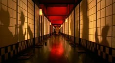 the shadows of people walking down an empty hallway