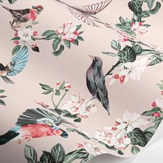 a pink wallpaper with birds and flowers on it