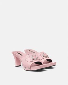 Medusa Buckle Patent Clogs 2.4" Pink | VERSACE US Designer High Heel Mules With Buckle Closure, Luxury Summer Mules With Wooden Heel, Luxury Mules With Wooden Heel For Summer, Luxury Mules With Wooden Heel For Spring, Formal Summer Clogs With Reinforced Heel, Luxury Clogs With Wooden Open Heel, Luxury Summer Clogs With Wooden Heel, Luxury Open Toe Clogs With Platform, Luxury Open Toe Platform Clogs