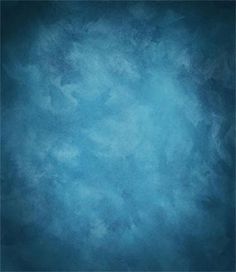 an abstract blue background with white clouds in the center and dark edges to the right