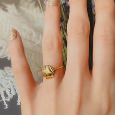 Title: Dainty Shell Ring Story: Beautiful scallop seashell ring in a dainty style. Material:  Solid 925 Silver, Vermeil (3 Micron 14k Gold Plating over Silver), and 14k Gold Plate over Brass Timeline:  Silver and 14k Gold Plate ship right away, Vermeil takes 2-3 weeks for me to make.  Size: Shell is 10 mm tall and 1.3 mm round band. Special Options: Need alternative sizes or materials? Message me. I also offer this ring in solid gold.  Packaging: All items are nicely packaged and ready to gift i Scallop Seashell, Seashell Ring, Gold Packaging, Beachy Jewelry, Dainty Style, Shell Ring, Solid Gold Chains, Lovely Jewellery, Favorite Rings