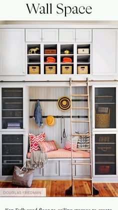 a room with white walls and shelves filled with items, including a ladder to the wall