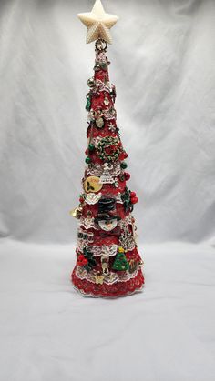 a small christmas tree with ornaments on it