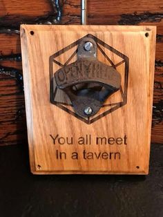 a wooden sign that says you'll meet in a tavern