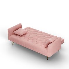 a pink couch with two pillows on the back and one pillow on the arm, sitting in front of a white background