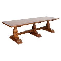 an old wooden table with two legs and a long slab on the top, against a white background