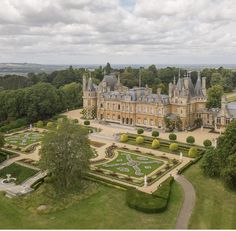 an aerial view of a large building surrounded by trees