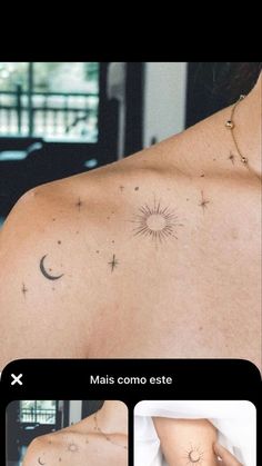 the back of a woman's shoulder with stars and moon tattoos on it