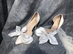 "Wedding Shoe Lace Charms, Silk Shoe Clips, Wedding Shoe Accessories, White Wedding Shoes Bows Clip A beautiful pair of bows made of high quality silk. I will make these bows for you in a neat and delicate way. You will get 99% same bows as the photo. These bows you can attach to your wedding shoes at the front, back, next to the ankle. You can also use them as an accessory to your handbag. They are very flexible for your ideas. Corlor: White, Ivory, Black, Beige,... 𝗗𝗲𝗹𝗶𝘃𝗲𝗿𝘆:  US, UK, CA, EU 10-15 business days Every where: 18-24  business days Shipping time is in business days, excluding Saturdays, Sundays and public holidays in our country * Please make sure to leave a note your wedding date and when you want to get the veil in your order. * If you want a paid express shipping s Satin Closed-toe Wedding Shoes, Summer Wedding Satin Shoes, Satin Closed Toe Wedding Shoes, Closed Toe Satin Heels For Wedding, Satin Closed Toe Heels For Wedding, Elegant Satin Wedding Shoes, High Heel Satin Wedding Shoes, Satin High Heel Wedding Shoes, Spring Wedding Heels With Satin Bow