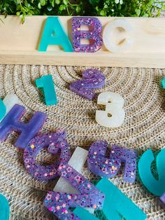 the letters and numbers are made out of soap blocks, with flowers in the background