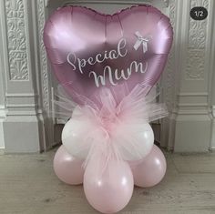 a pink heart shaped balloon with the words special mum on it