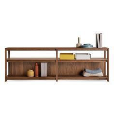 a book shelf with books, vases and other items on it in front of a white background