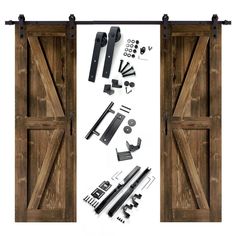 an open barn door with hardware and tools on the bottom, next to it is a pair of sliding doors