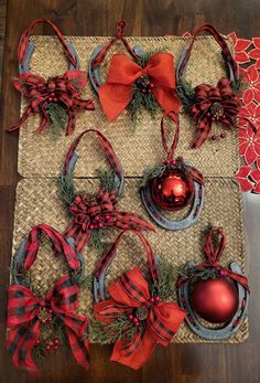 red and green ornaments are placed on a mat with ribbon around the edges, as well as an ornament