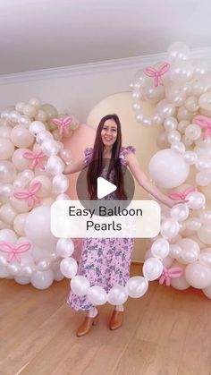 a woman standing in front of balloons with the words easy balloon pearls written on it