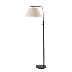 a black floor lamp with a white shade