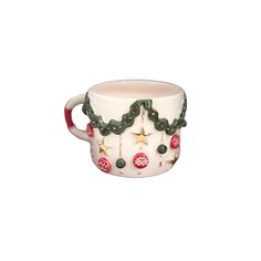 a white coffee cup with christmas decorations on it