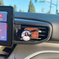 a car dashboard with an image of a woman on it