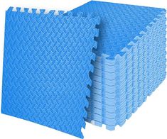 several blue mats stacked on top of each other