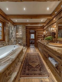 a large bathroom with stone walls and flooring, along with a jacuzzi tub