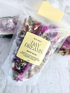 Handmade. Small Batch. Made with a blend of essential oils and natural ingredients. Day Dream Bath Soak Ingredients: Epsom Salt, Pink Himalayan Salt, Jasmine Buds, Amaranth, Rose, Chamomile, Lavender, Essential Oil Blend. 7oz bag How to use: Empty desired amount into running bath water. Allow tub to dry for easy cleanup. 2-3 baths per bag Holiday Bath Salts, Bath Salts Packaging Ideas, Bath Salts Diy Recipes, Self Care Bath, White Witchcraft, Bath Salts Diy, Spiritual Bath, Dream Bath, Herbal Bath