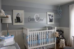 a baby's room decorated in blue and gray