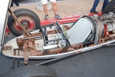 an old race car sitting on display in a museum