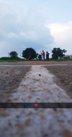 two people are flying a kite in the sky