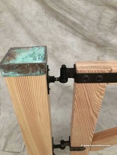 two pieces of wood with metal brackets attached to them