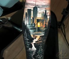 a man's arm with a city scene on it