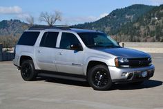 a silver suv parked in a parking lot