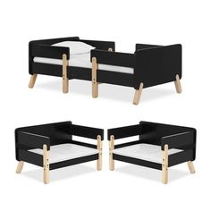 three black and white toddler beds with wooden legs