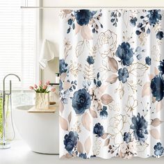 a shower curtain with blue flowers on it