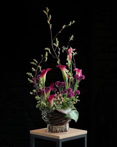 a basket filled with flowers on top of a table